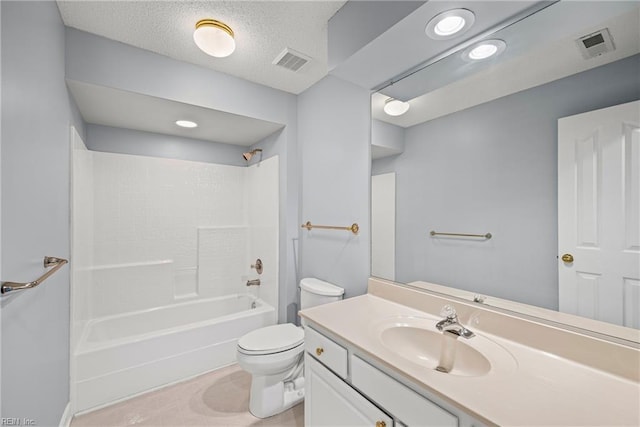 bathroom featuring vanity, toilet, visible vents, and a textured ceiling