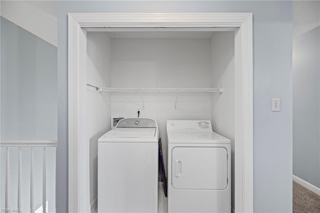 clothes washing area featuring laundry area, separate washer and dryer, and carpet floors