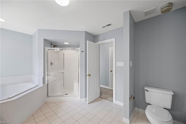 bathroom with tile patterned floors, visible vents, a stall shower, and a bath