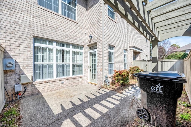 view of patio featuring fence