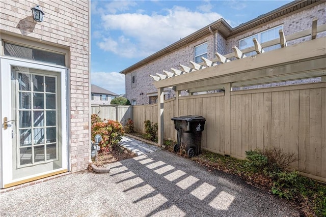 view of patio with fence and a pergola