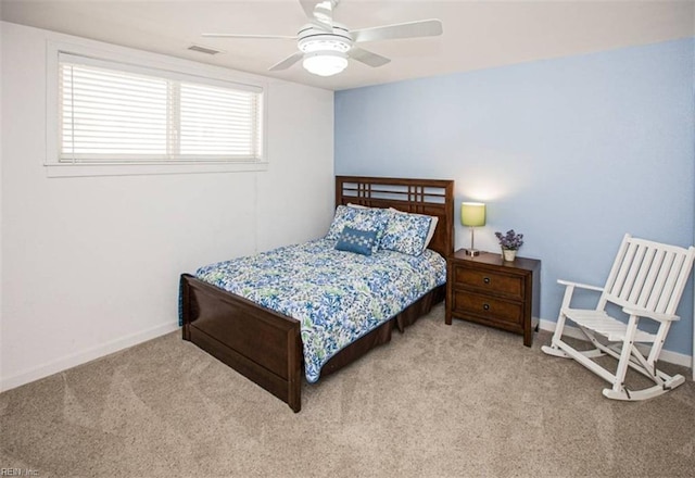 carpeted bedroom featuring visible vents, ceiling fan, and baseboards