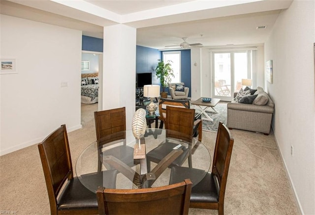dining space with carpet, a ceiling fan, visible vents, and baseboards