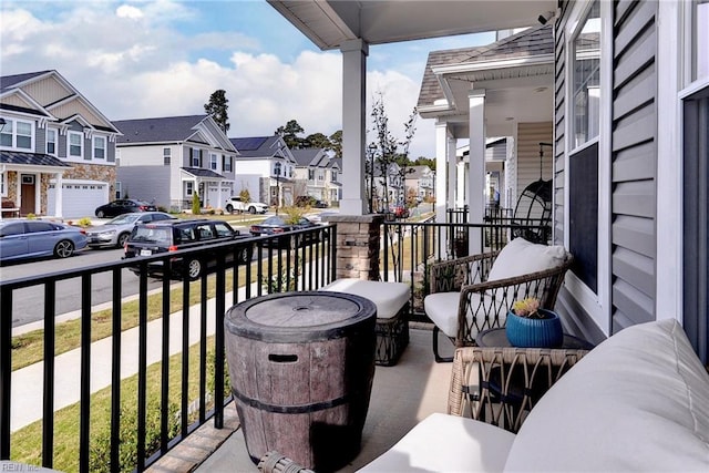 balcony with a residential view and covered porch