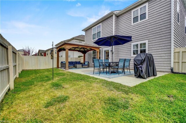 back of house with a fenced backyard, an outdoor living space, a gazebo, a patio area, and a lawn