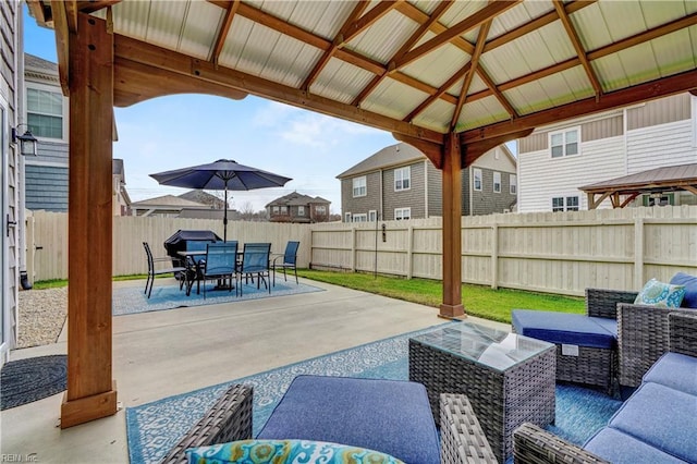 view of patio / terrace with a fenced backyard, an outdoor living space, a gazebo, and outdoor dining area