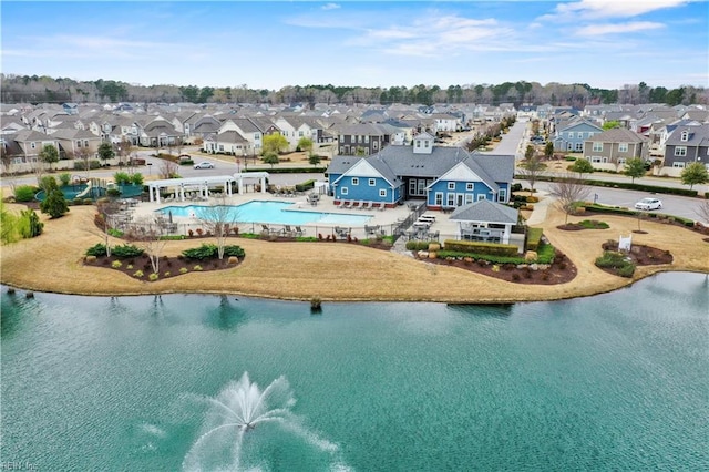 bird's eye view with a water view and a residential view