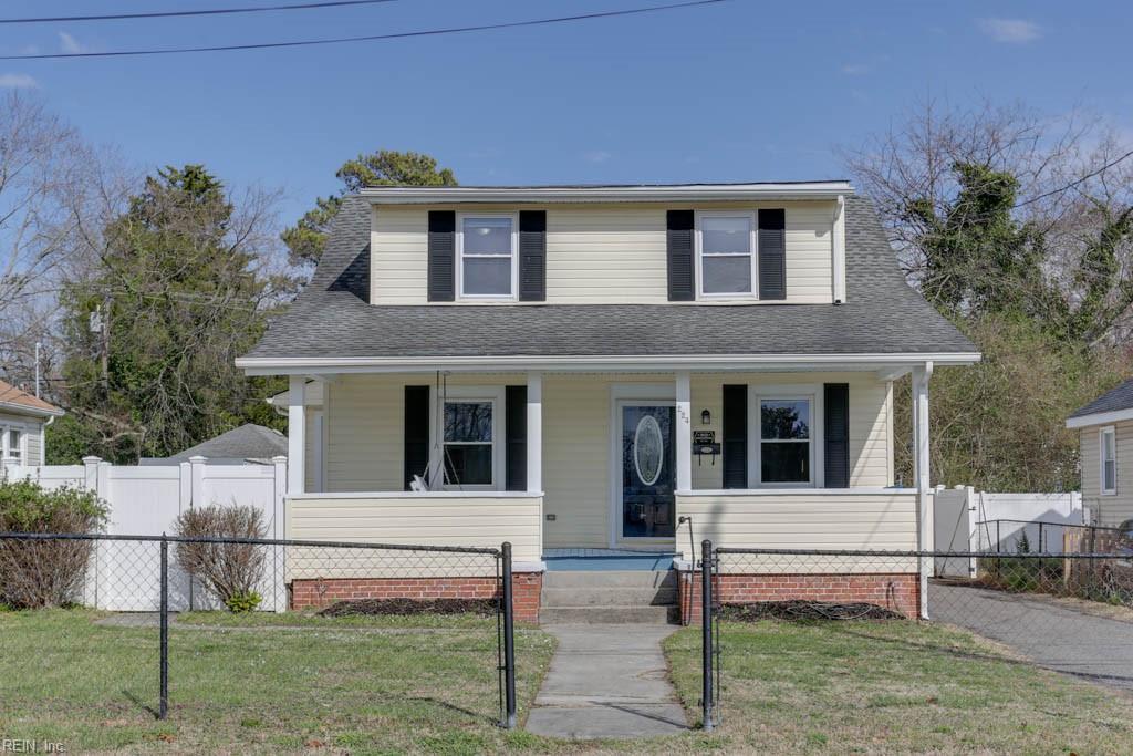 bungalow featuring a fenced front yard, covered porch, a front yard, and a gate
