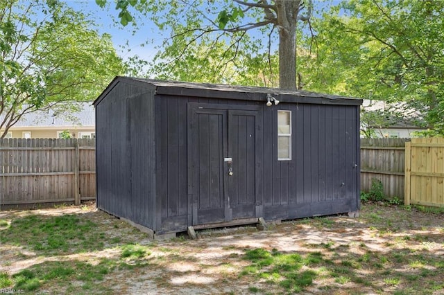 view of shed with a fenced backyard