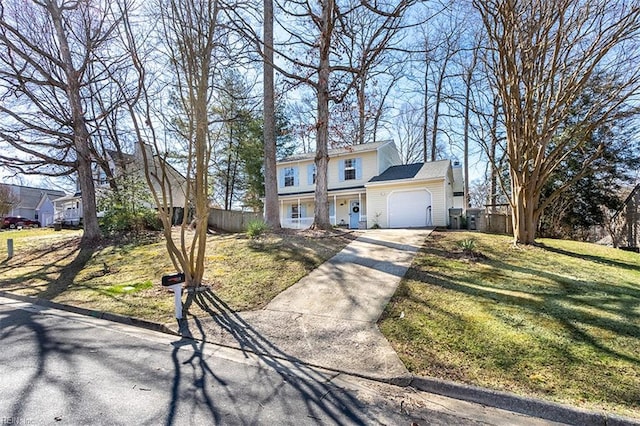 view of front of home featuring a front lawn, concrete driveway, an attached garage, and fence