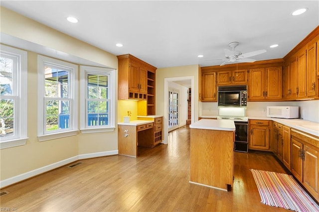 kitchen featuring open shelves, a kitchen island, white appliances, light countertops, and dark wood-style flooring