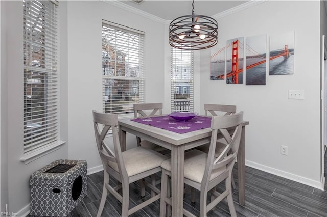 dining area featuring a notable chandelier, baseboards, wood tiled floor, and ornamental molding