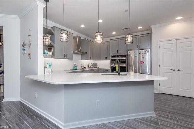 kitchen featuring gray cabinets, appliances with stainless steel finishes, wall chimney range hood, and open shelves