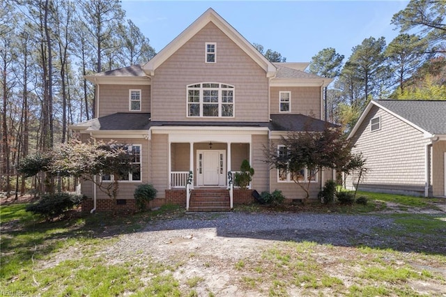 view of front of house featuring covered porch and crawl space