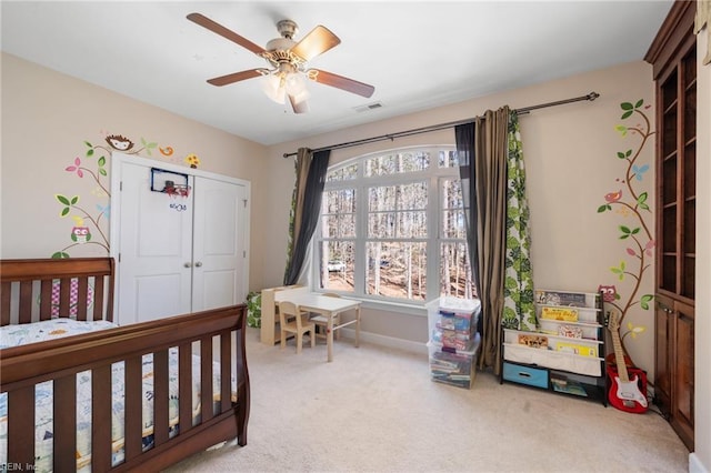 bedroom featuring carpet, a closet, ceiling fan, and visible vents