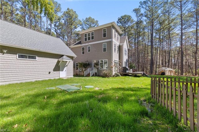 back of house featuring a yard