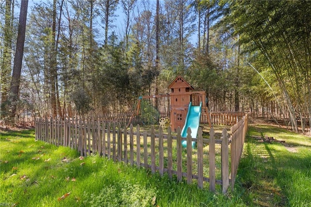 view of jungle gym featuring fence