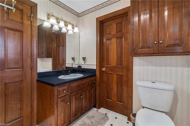 bathroom with toilet and vanity