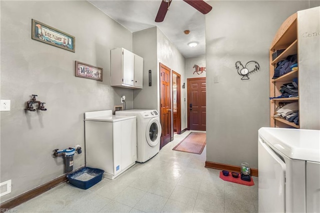 washroom with baseboards, a ceiling fan, cabinet space, washing machine and dryer, and light floors