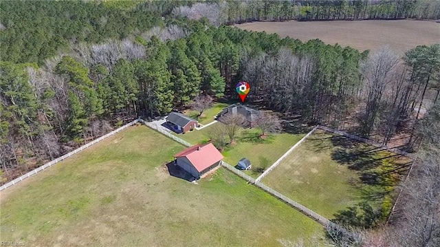 birds eye view of property with a wooded view and a rural view