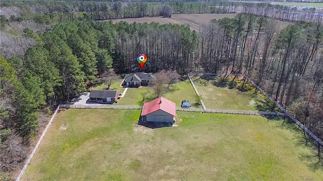 birds eye view of property with a rural view and a view of trees