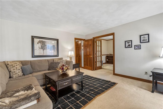 living room featuring baseboards and light colored carpet