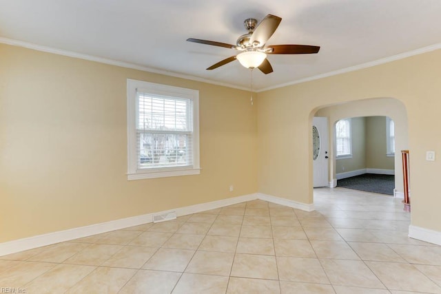 507 Bellwood Rd, Newport News, VA 23601 - empty room with baseboards, ceiling fan, ornamental molding, light tile patterned floors, and arched walkways
