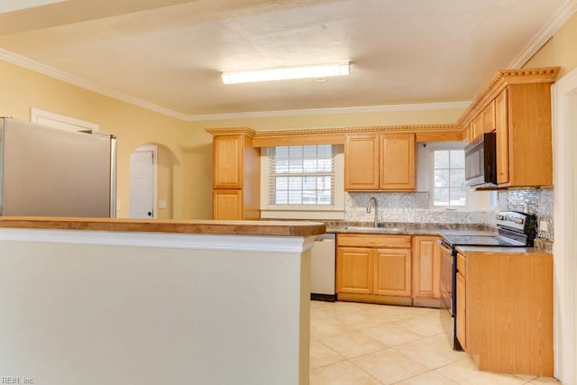 507 Bellwood Rd, Newport News, VA 23601 - kitchen with tasteful backsplash, crown molding, light tile patterned flooring, stainless steel appliances, and a sink