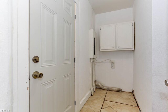 507 Bellwood Rd, Newport News, VA 23601 - laundry area with light tile patterned flooring and cabinet space