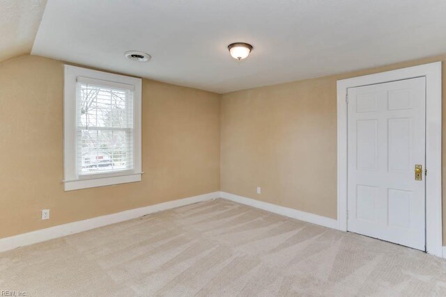 507 Bellwood Rd, Newport News, VA 23601 - spare room with visible vents, carpet, baseboards, and lofted ceiling