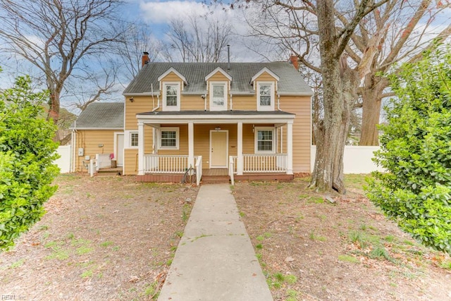 507 Bellwood Rd, Newport News, VA 23601 - view of front of property with covered porch, a chimney, and fence