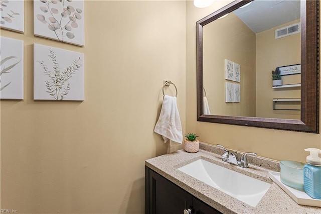 bathroom featuring vanity and visible vents