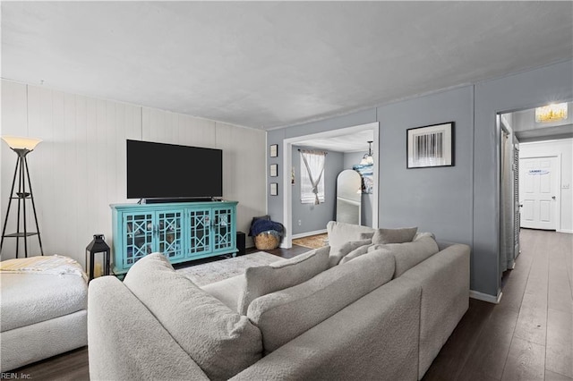 living room with baseboards and hardwood / wood-style flooring