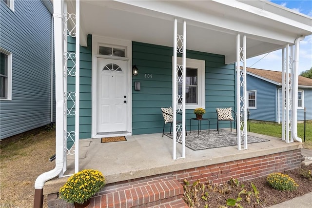 doorway to property featuring covered porch
