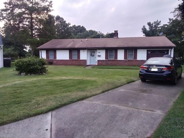 ranch-style home featuring driveway, brick siding, an attached garage, and a front yard