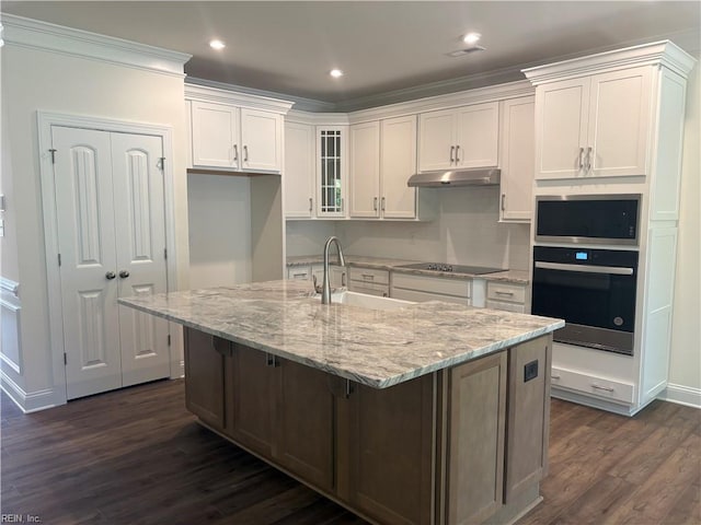 2050 Swiss Ln, Hayes, VA 23072 - kitchen with oven, under cabinet range hood, black electric stovetop, white cabinets, and dark wood-style floors
