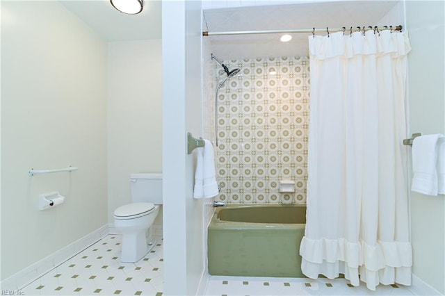 bathroom featuring tile patterned flooring, shower / bath combination with curtain, toilet, and baseboards