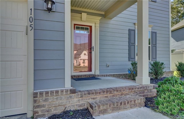 doorway to property with a porch