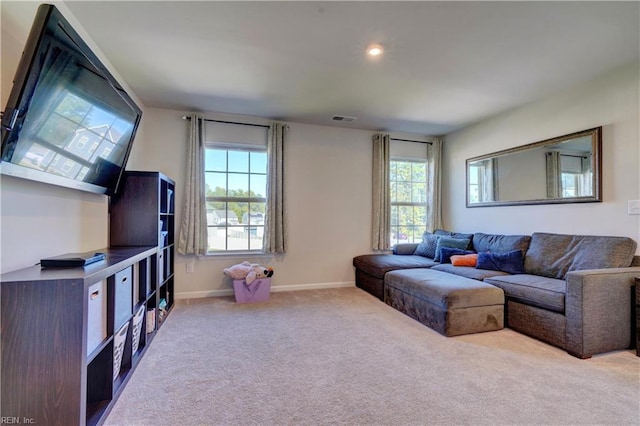 carpeted living room with recessed lighting, visible vents, a healthy amount of sunlight, and baseboards