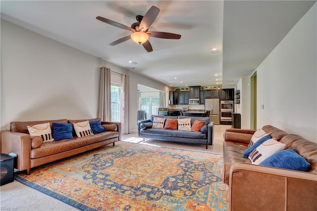 living area with recessed lighting, light colored carpet, and ceiling fan