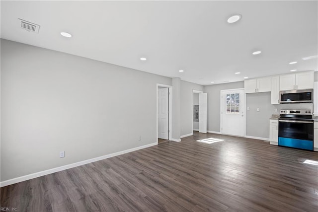 unfurnished living room featuring dark wood finished floors, recessed lighting, baseboards, and visible vents