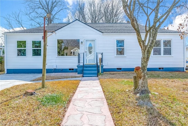view of front of home featuring roof with shingles and crawl space