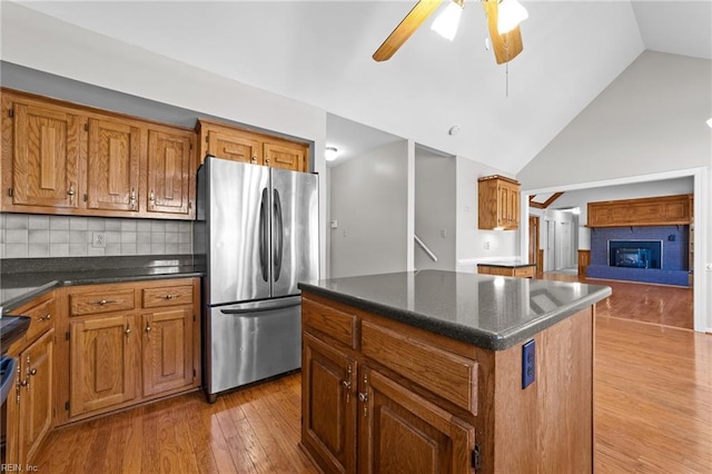 4825 Berrywood Rd, Virginia Beach, VA 23464 - kitchen featuring freestanding refrigerator, light wood-style flooring, and brown cabinets