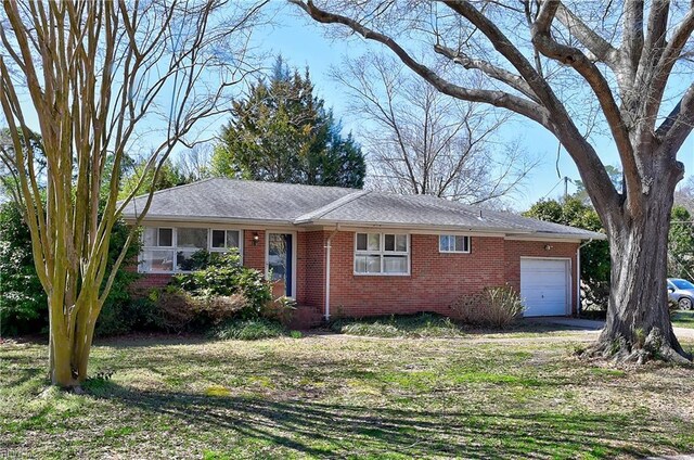 ranch-style home with brick siding and an attached garage