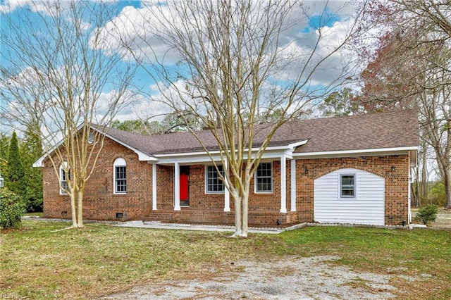 ranch-style house featuring a front yard, brick siding, and roof with shingles