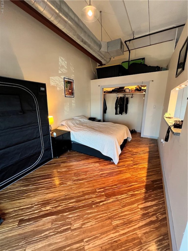 bedroom with wood finished floors