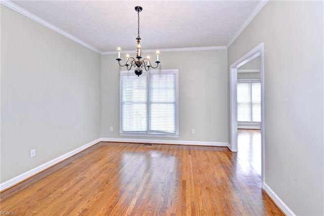 296 Walt Whitman Ave, Newport News, VA 23606 - spare room with a notable chandelier, crown molding, baseboards, and wood finished floors