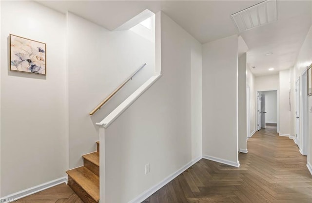 stairway with recessed lighting, attic access, baseboards, and visible vents