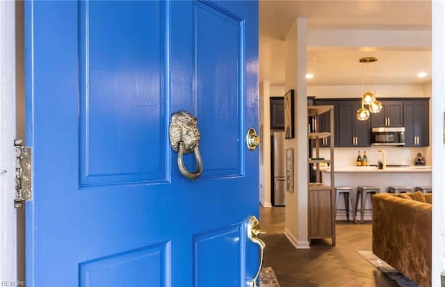 foyer entrance with dark wood-type flooring