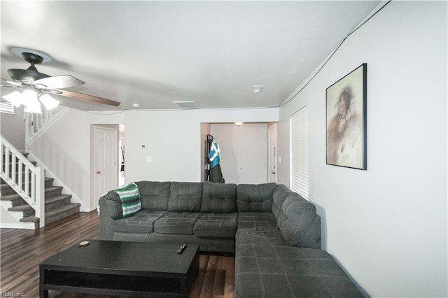 living area with stairway, ceiling fan, visible vents, and wood finished floors